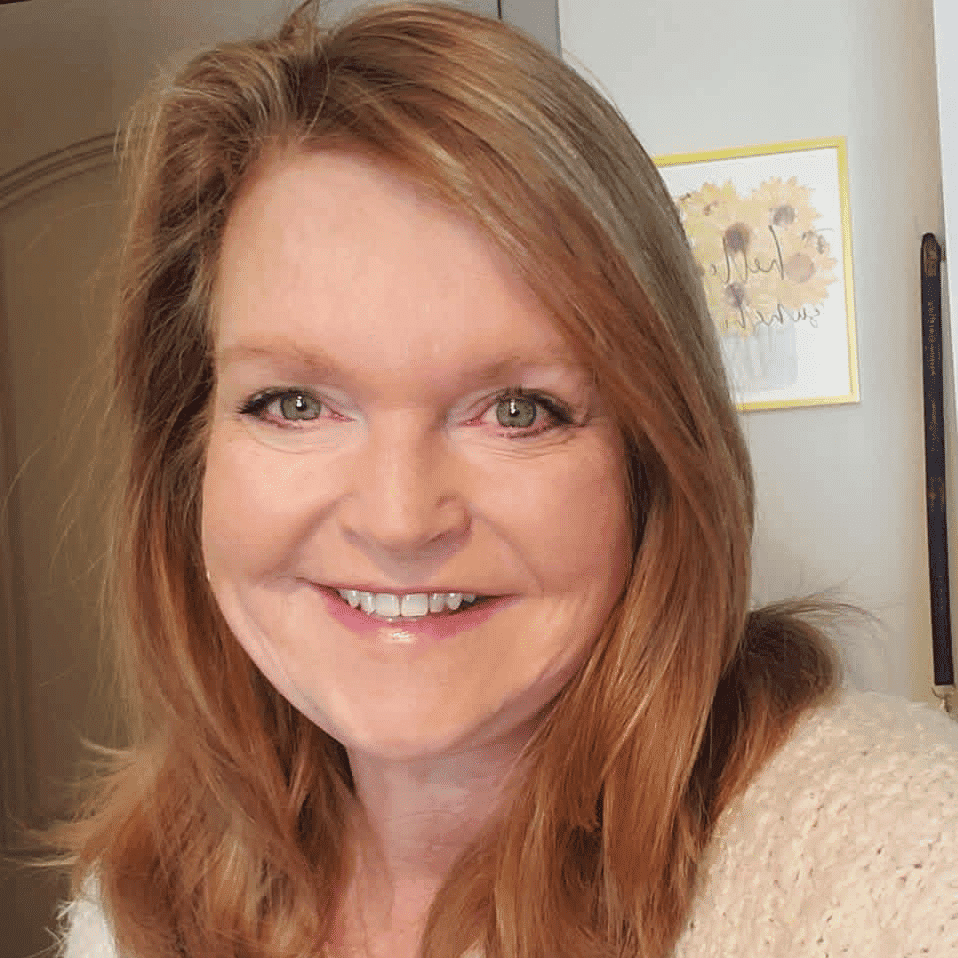 Portrait of Elizabeth Street, a professional stylist at Q Salon & Spa, showcasing their expertise and style.