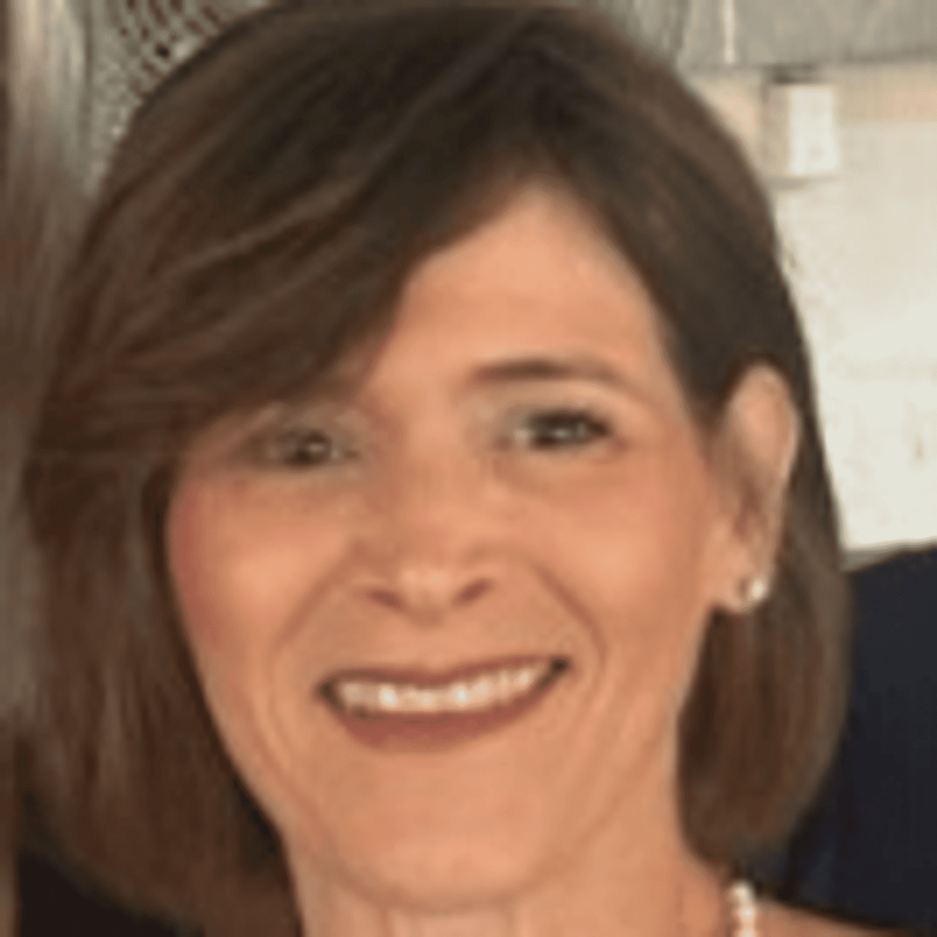 Portrait of Debbie Kaminski, a professional stylist at Q Salon & Spa, showcasing their expertise and style.