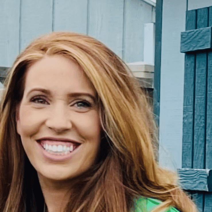 Portrait of Jill Quinn, a professional stylist at Q Salon & Spa, showcasing their expertise and style.