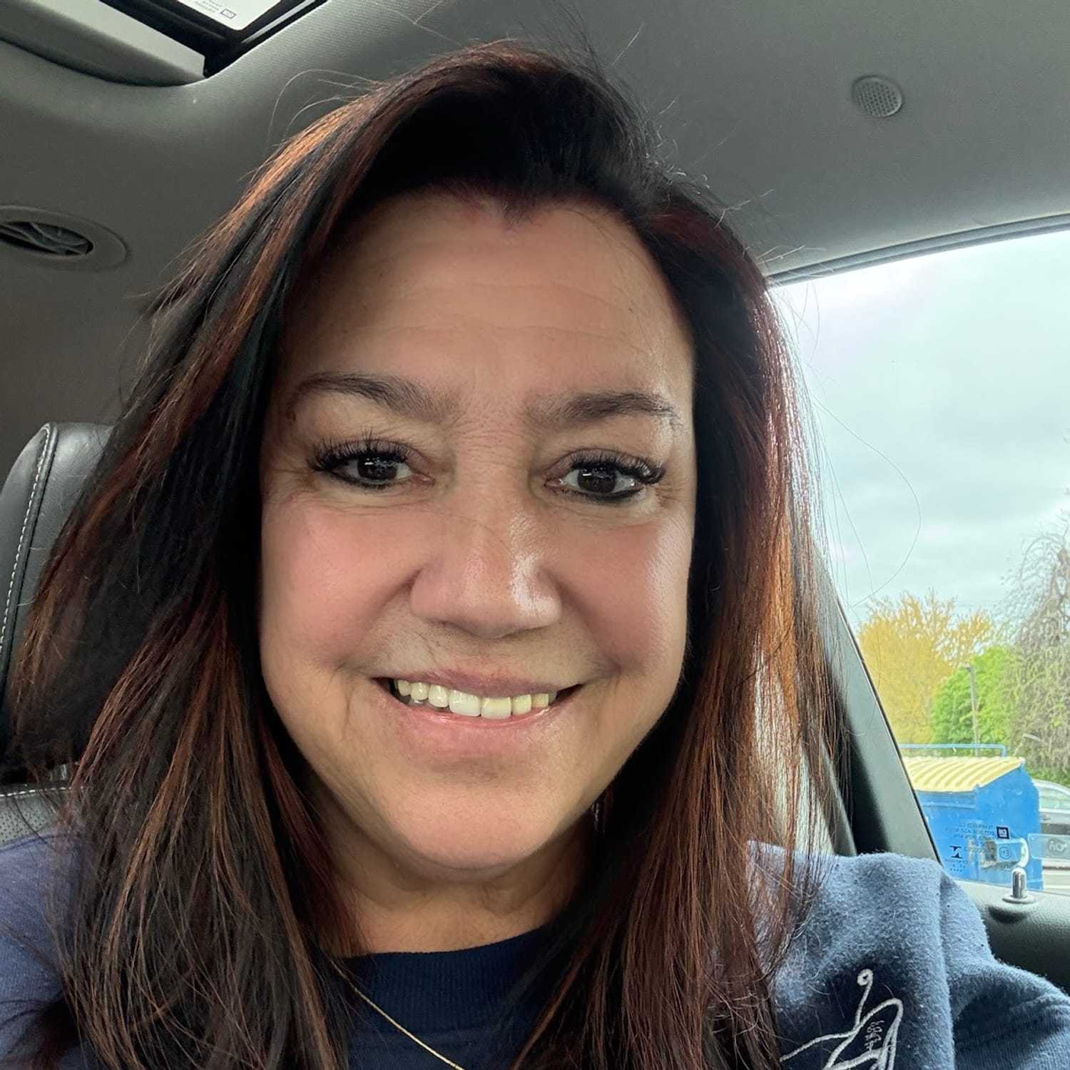 Portrait of Bernadette Vitale, a professional stylist at Q Salon & Spa, showcasing their expertise and style.