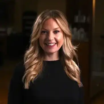 Portrait of Jennifer Dillon, a professional stylist at Q Salon & Spa, showcasing their expertise and style.