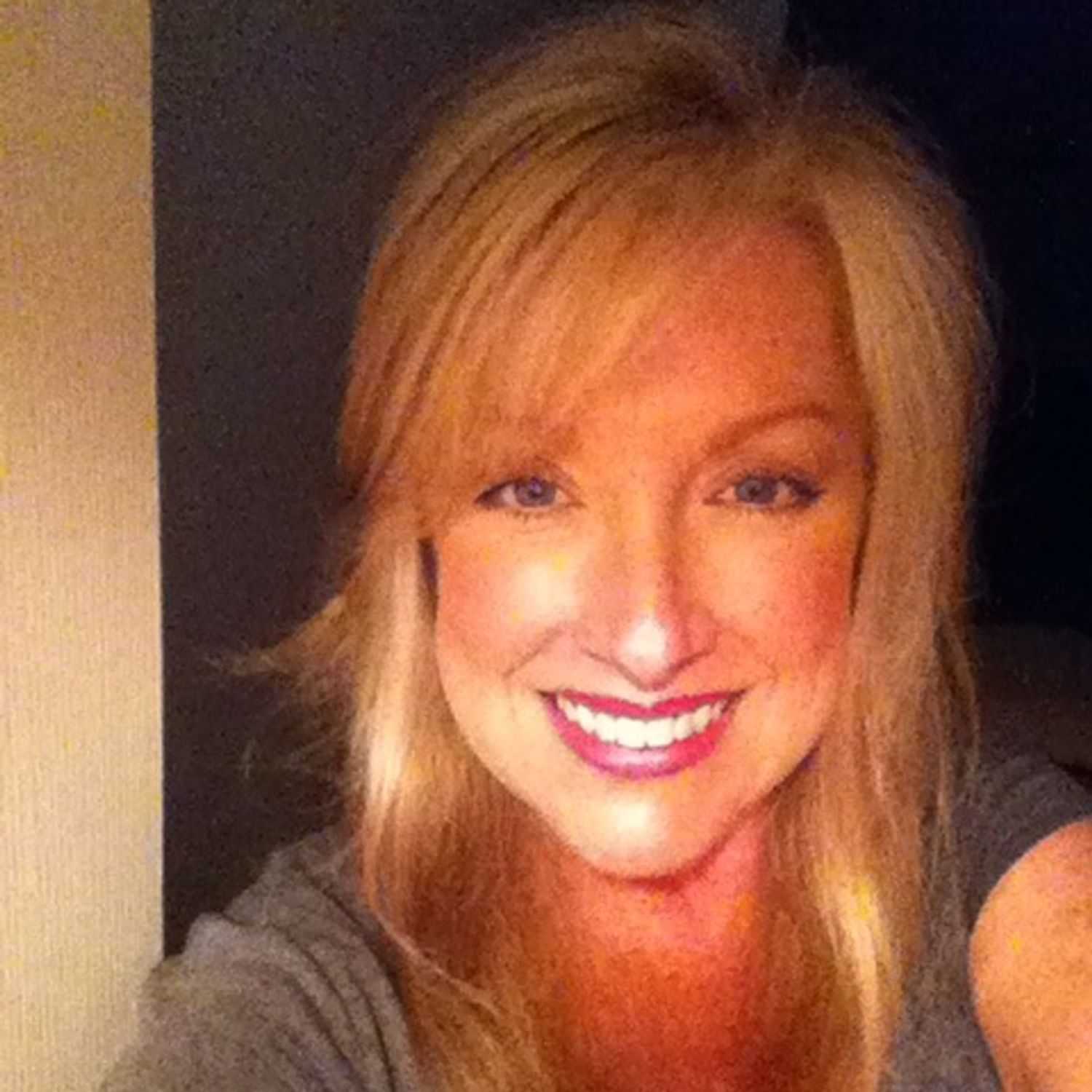 Portrait of Heather Brong, a professional stylist at Q Salon & Spa, showcasing their expertise and style.