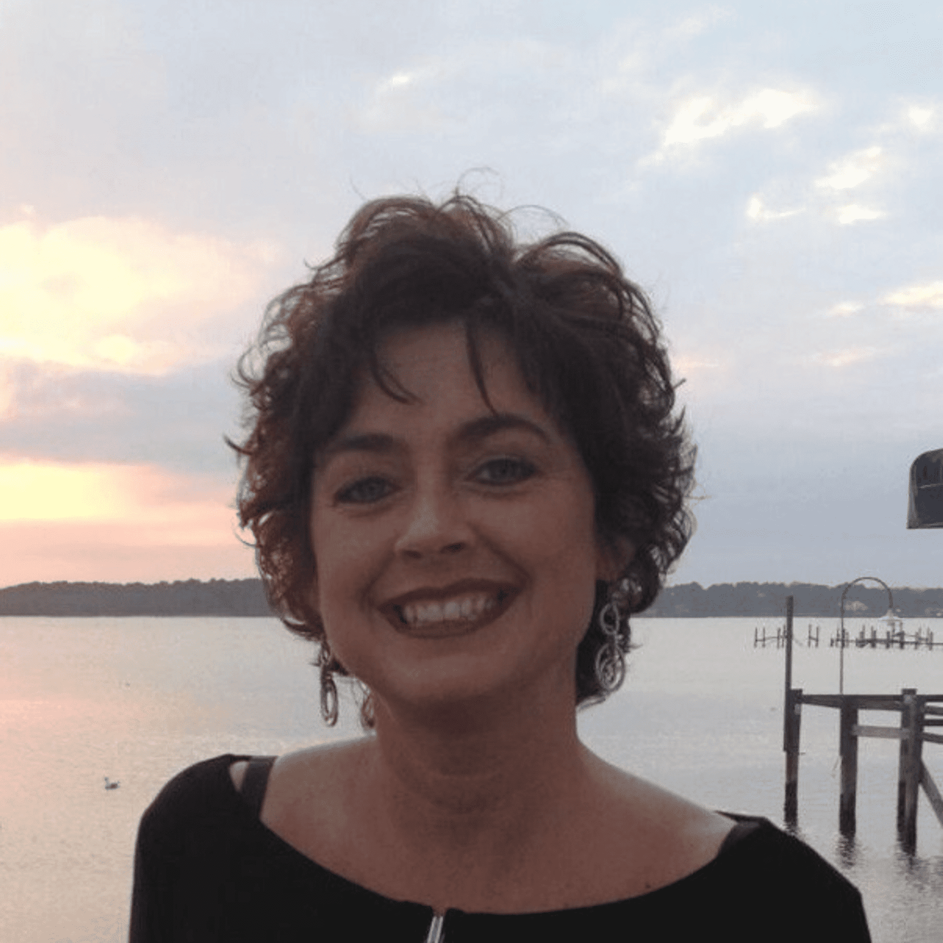 Portrait of Lisa Marshall, a professional stylist at Q Salon & Spa, showcasing their expertise and style.