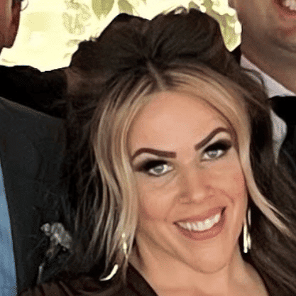 Portrait of Susan Albright, a professional stylist at Q Salon & Spa, showcasing their expertise and style.