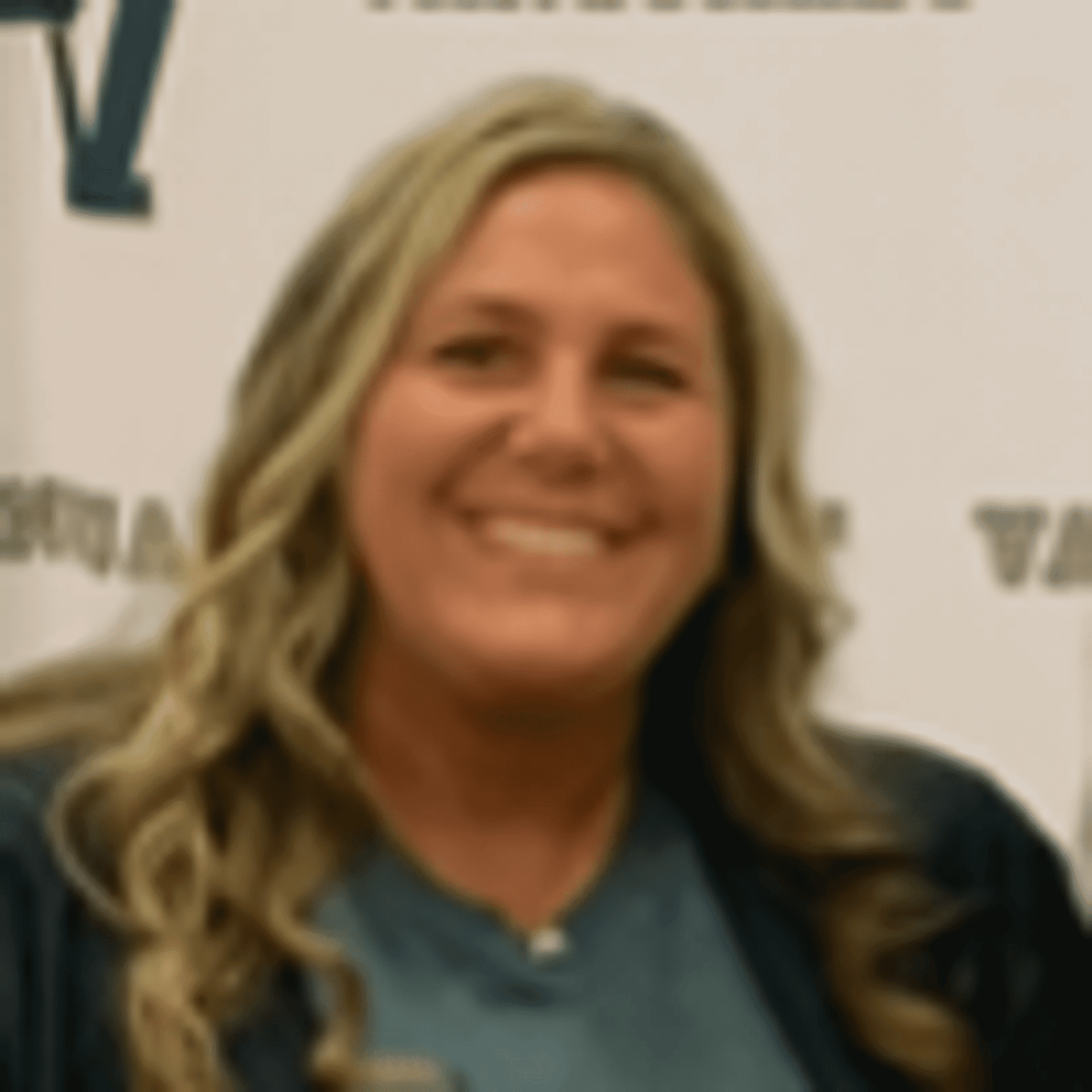 Portrait of Meredith Thompson, a professional stylist at Q Salon & Spa, showcasing their expertise and style.