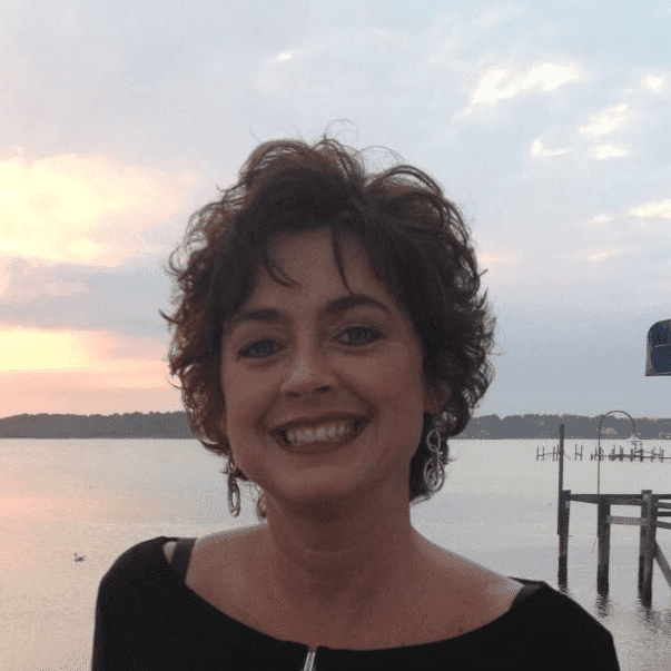 Portrait of Lisa Marshall, a professional stylist at Q Salon & Spa, showcasing their expertise and style.