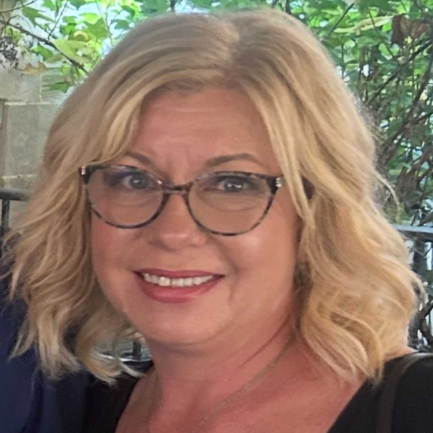 Portrait of Christine Boub, a professional stylist at Q Salon & Spa, showcasing their expertise and style.