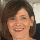 Portrait of Debbie Kaminski, a professional stylist at Q Salon & Spa, showcasing their expertise and style.