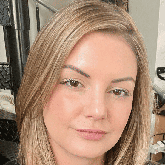 Portrait of Steph Nicole, a professional stylist at Q Salon & Spa, showcasing their expertise and style.