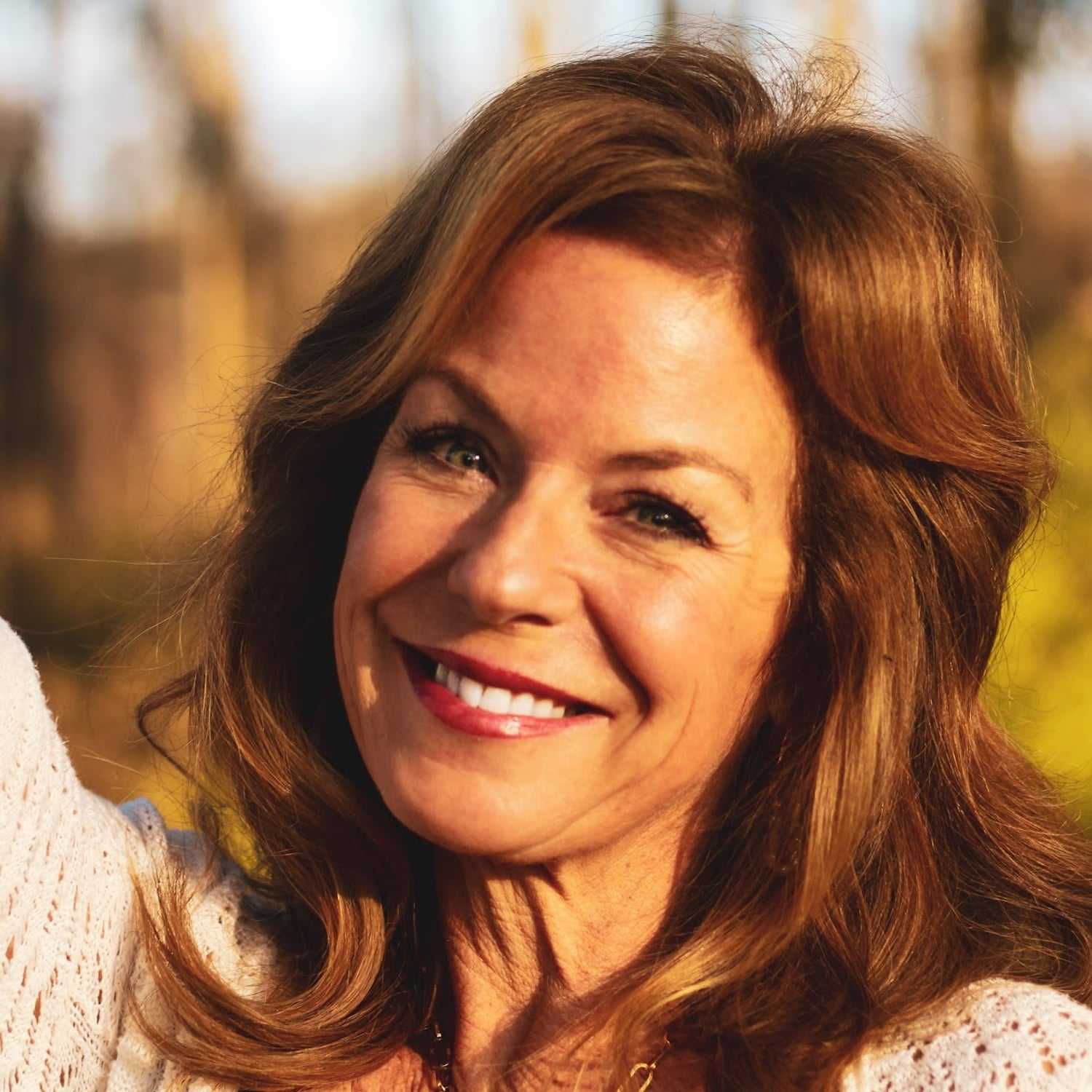 Portrait of Barb Leone, a professional stylist at Q Salon & Spa, showcasing their expertise and style.